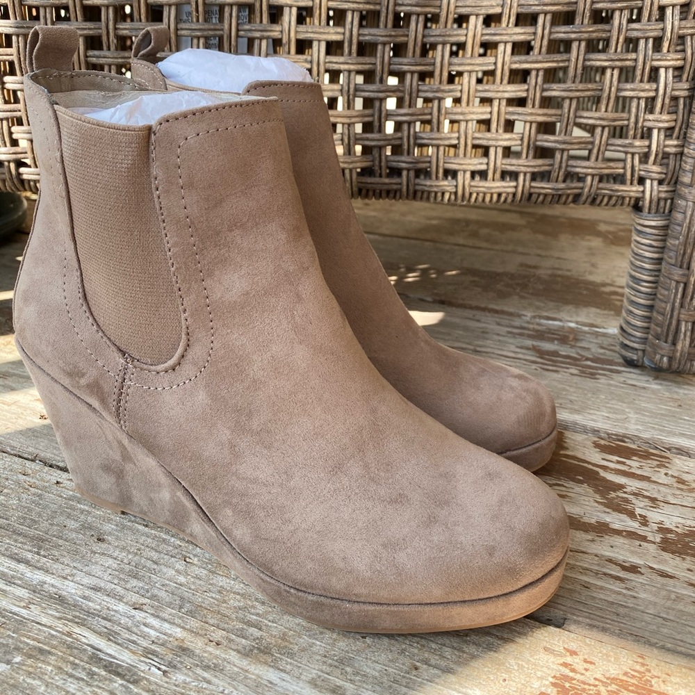 Tan wedge boots.
